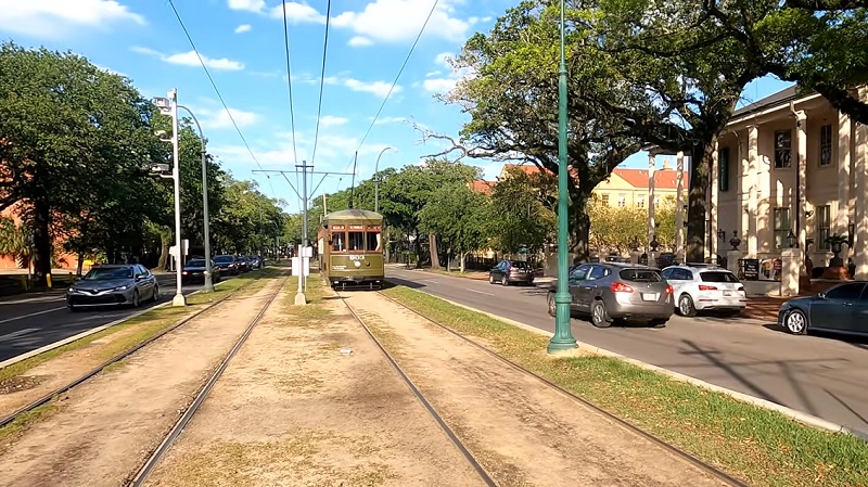 A classic New Orleans streetcar rolls down scenic St. Charles Avenue