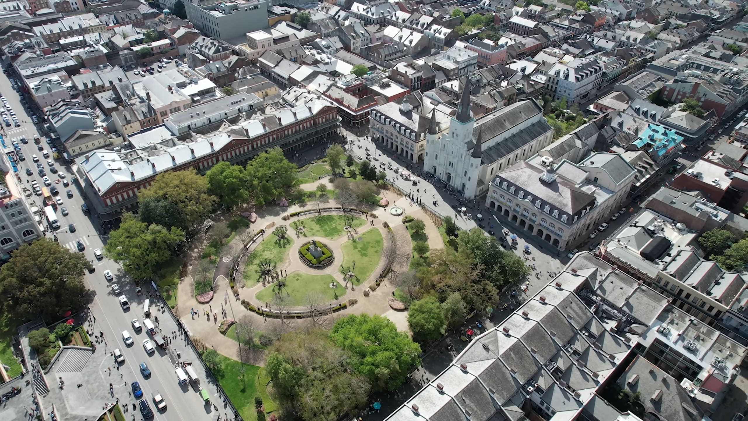 Aerial view of Jackson Square in New Orleans surrounded by historic buildings and St. Louis Cathedral