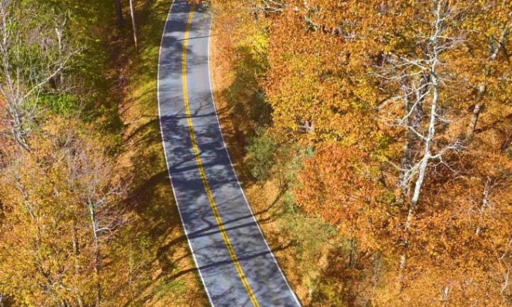 Aerial view of a road in the middle of Blue Ridge Parkway in autumn